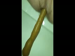 Long nasty poop comes out of a bitch's ass hole